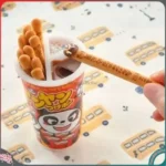 Bánh que chấm Socola phủ cốm Panda Meiji